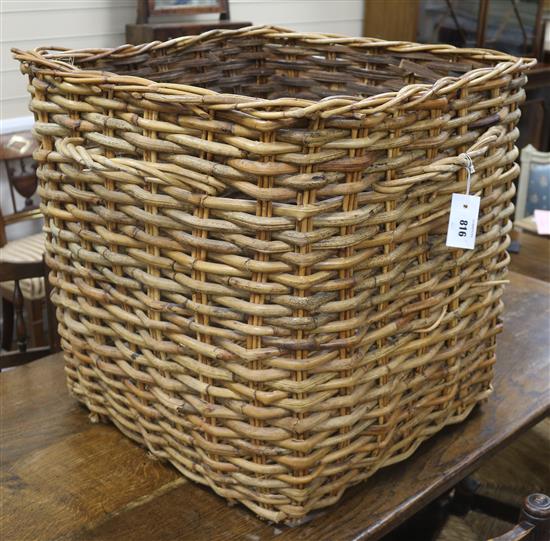 A large wicker laundry or log basket, W.65cm